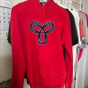 Aritzia Bold Red Hoodie with Artistic Emblem